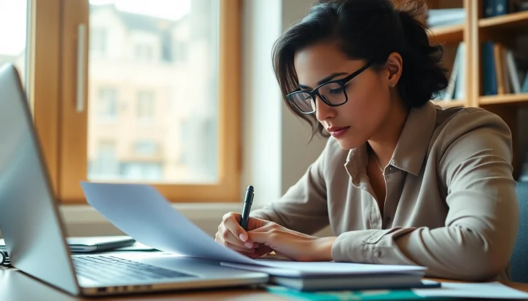 Person completing the eta uk application form at a desk, surrounded by travel documents.
